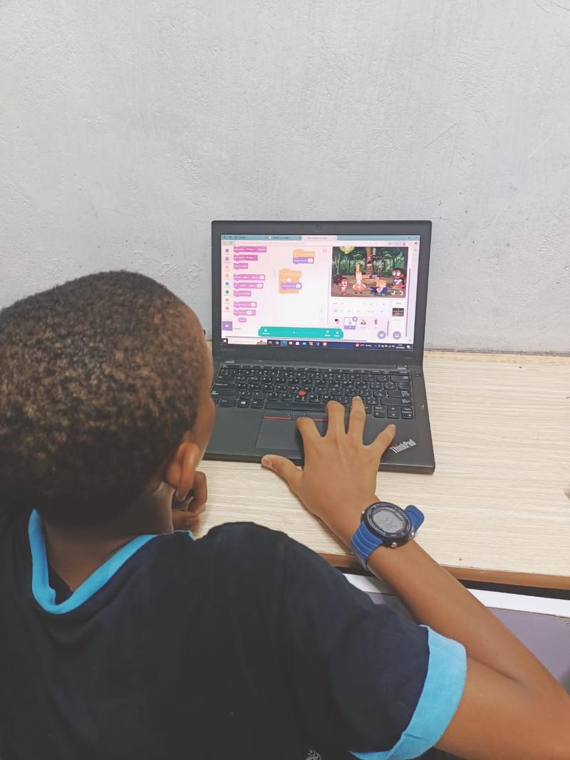 Young learner coding on a laptop