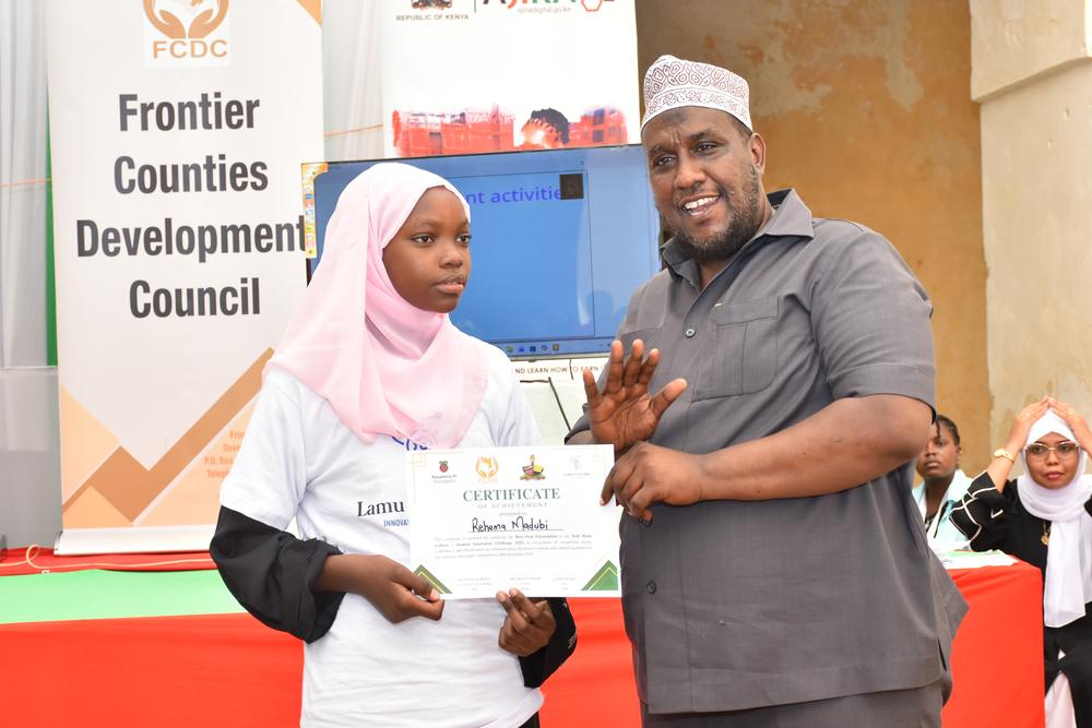 Partner presenting an award to a student