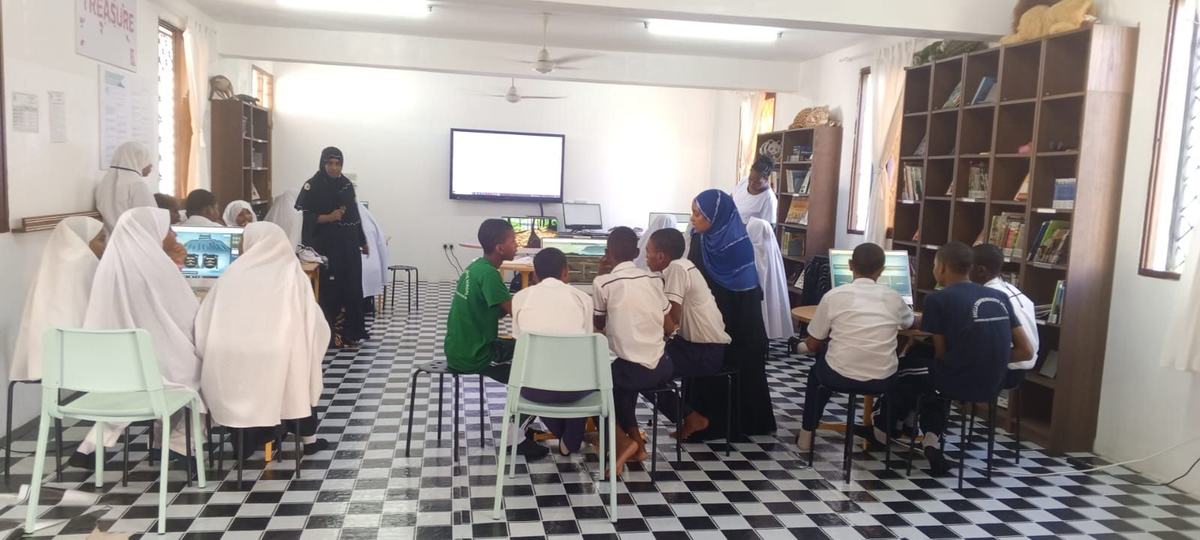 Innovation Club students working on computers in a Lamu school library