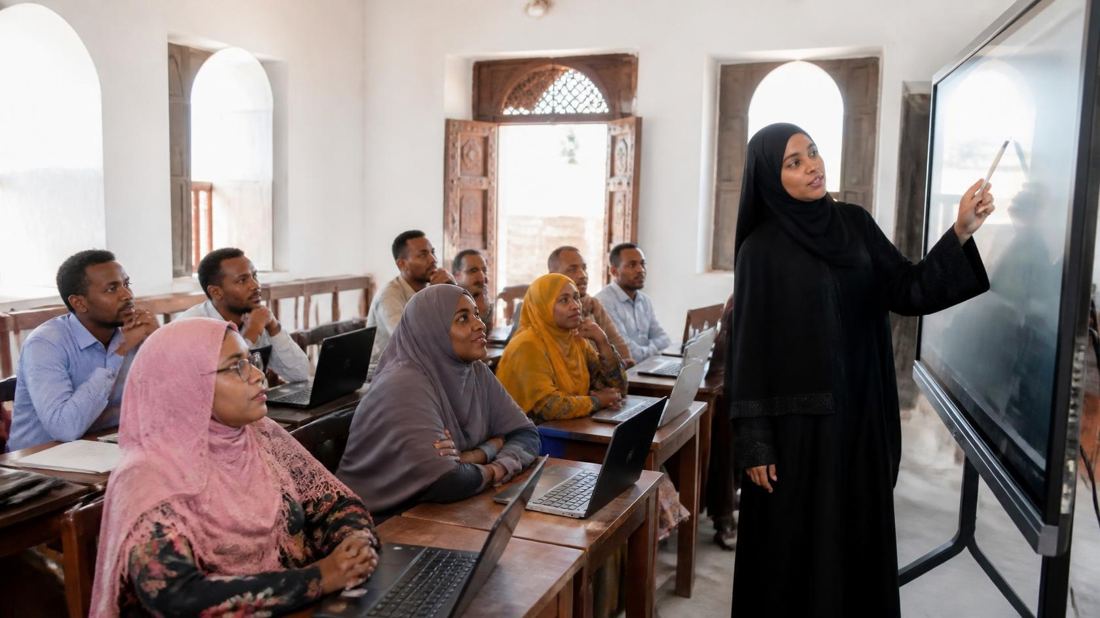 Lamu teachers learning to use laptops and a smart screen