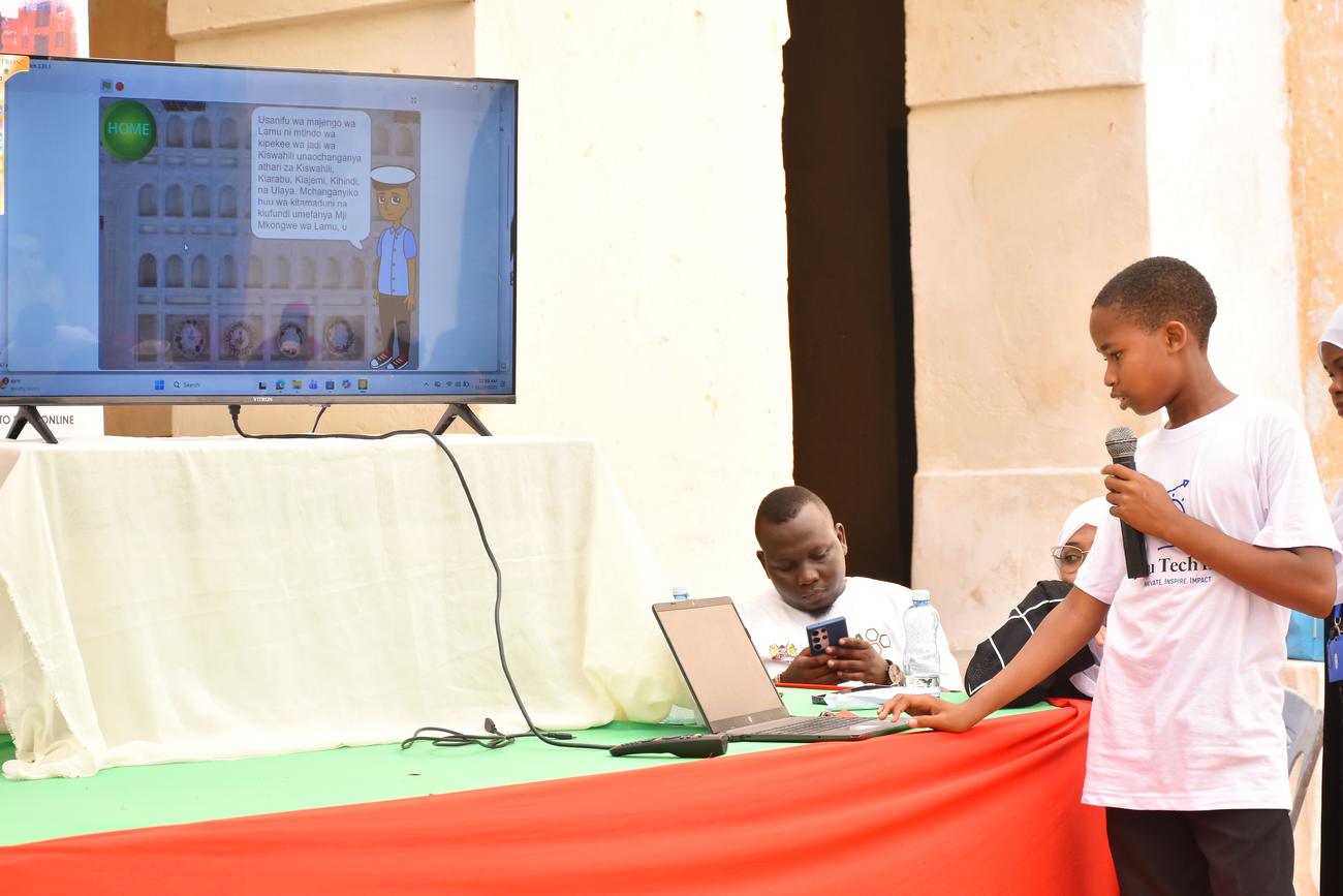 Student presenting his app on screen